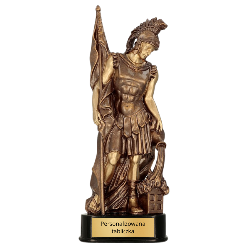 Statuetka odlewana RFST3025 Święty Florian w brązowym kolorze na ciemnej podstawie. Model strażacki z postacią patrona strażaków sprawdzi się jako nagroda, wyróżnienie lub upominek okolicznościowy. Miejsce na tabliczkę z nadrukiem.